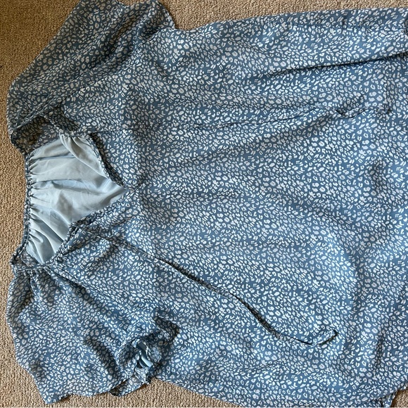 Polyester, blue & white blouse with two strings in the front. Flowy & runs big - Picture 2 of 3